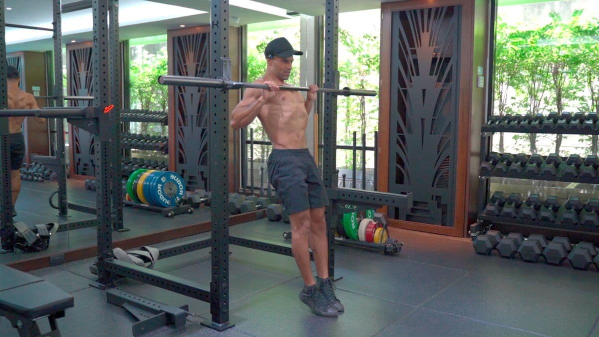 Kemo Marriott demonstrating a supported pull-up with feet on a bench